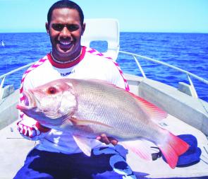 Ty Willams from the North Queensland Cowboys with a scarlet sea perch onboard a One More Cast Fishing Adventures charter. 